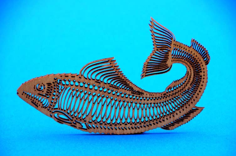 A fish which is highly detailed design that has been cut  to shape with a  laser.  