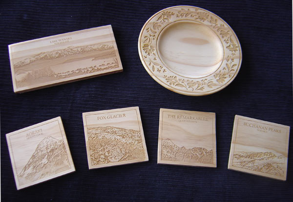 Wooden coasters and plate that have been laser engraved with images and patterns