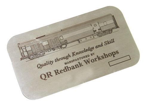 Stainless steel nameplate laser engraved with a company logo