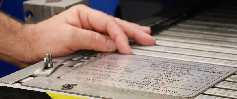 a plates being setup in the laser machine to be laser engraved