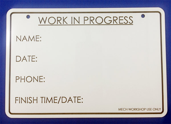 white board that has been laser cut and laser marked.