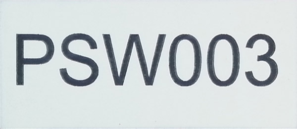 Small laser cut and engraved black and white traffolyte panel marked with serial and identification numbers.